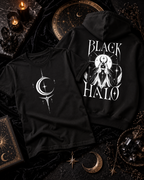 A black hoodie with a white Black Halo graphic beside a black tee with a white crescent and star.