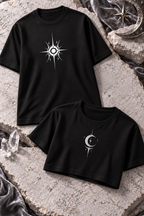A black tee with a white sun graphic beside a black cropped top with a white crescent and star.